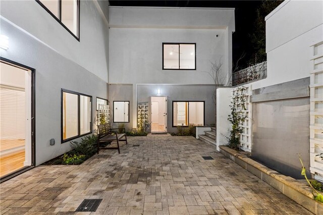 patio at night with a towering ceiling