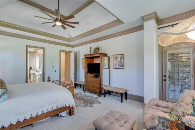 carpeted bedroom featuring a tray ceiling, ceiling fan, and crown molding