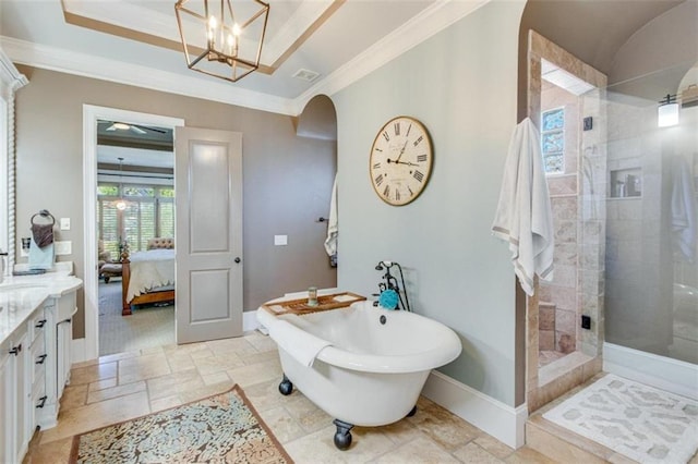 bathroom featuring a chandelier, shower with separate bathtub, vanity, and ornamental molding