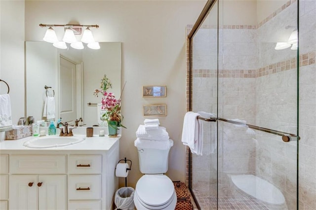 bathroom with vanity, toilet, and an enclosed shower