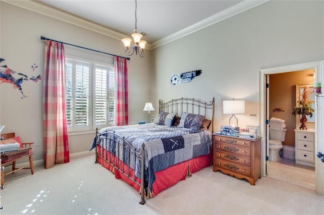 carpeted bedroom with ensuite bathroom, an inviting chandelier, and ornamental molding