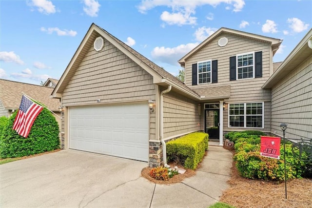 front of property with a garage