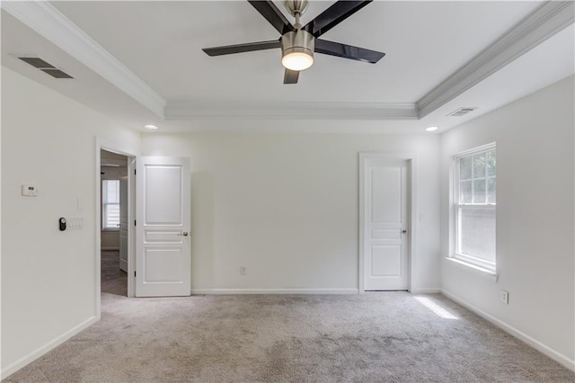 7653 Legacy Rd, Flowery Branch, GA 30542 - carpeted spare room with crown molding, a tray ceiling, healthy amount of natural light, ceiling fan, and baseboards