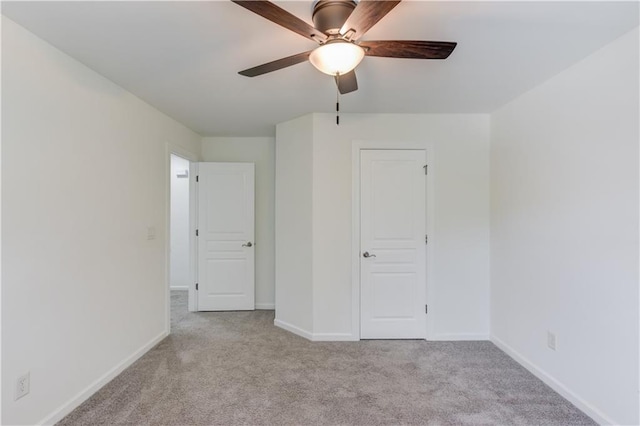 7653 Legacy Rd, Flowery Branch, GA 30542 - unfurnished bedroom with carpet floors, baseboards, and a ceiling fan