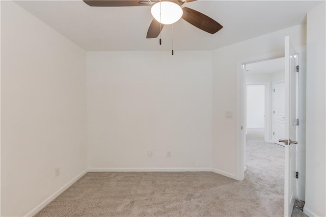 7653 Legacy Rd, Flowery Branch, GA 30542 - empty room featuring light carpet, ceiling fan, and baseboards