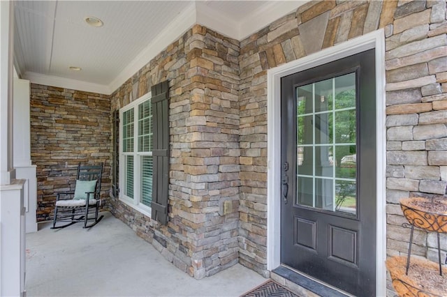7653 Legacy Rd, Flowery Branch, GA 30542 - doorway to property featuring a porch and stone siding