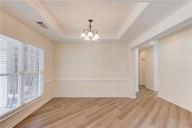 7653 Legacy Rd, Flowery Branch, GA 30542 - unfurnished room with a chandelier, light wood-type flooring, crown molding, a tray ceiling, and baseboards