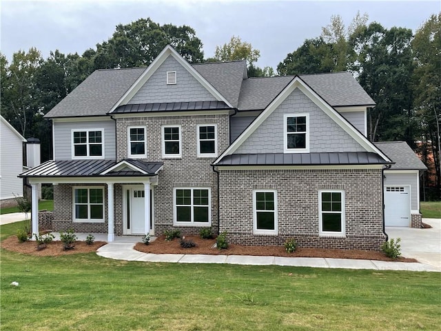 craftsman-style home featuring a front yard and a garage