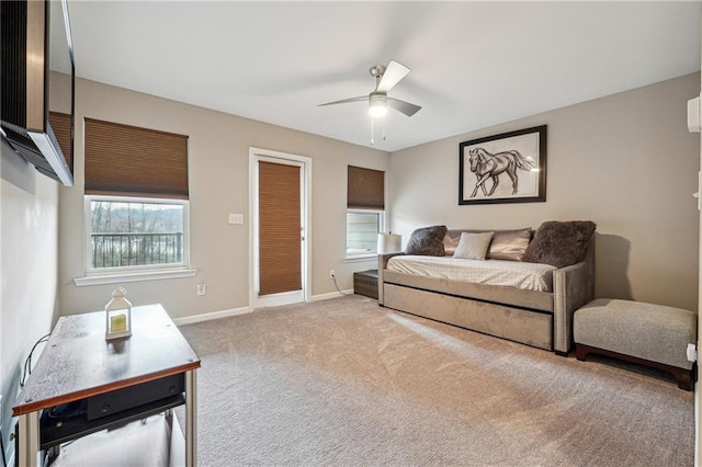 carpeted bedroom featuring ceiling fan and baseboards