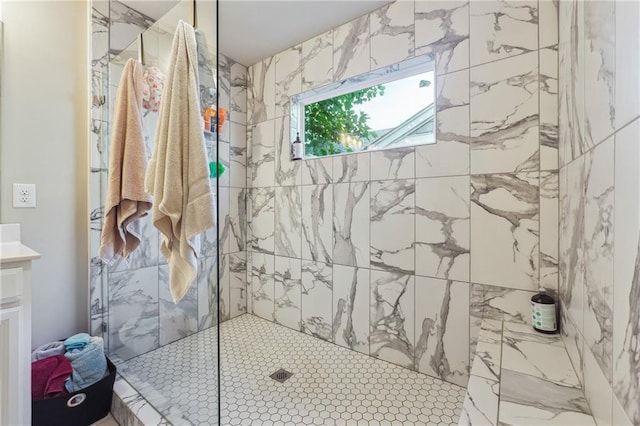 bathroom featuring vanity and a tile shower