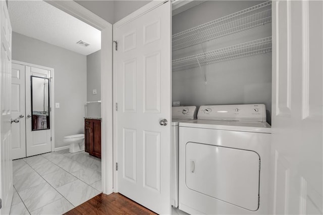 laundry area featuring separate washer and dryer