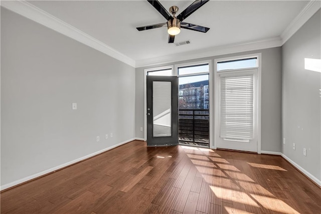 unfurnished room with hardwood / wood-style flooring, ornamental molding, and ceiling fan