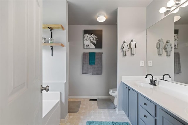 244 Bryn Brooke Dr, Dawsonville, GA 30534 - bathroom featuring toilet, double vanity, baseboards, and a tub