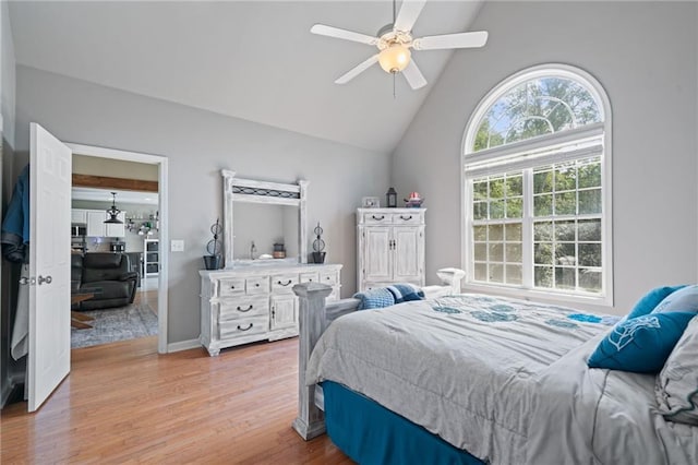 244 Bryn Brooke Dr, Dawsonville, GA 30534 - bedroom featuring light wood finished floors, high vaulted ceiling, a ceiling fan, and baseboards