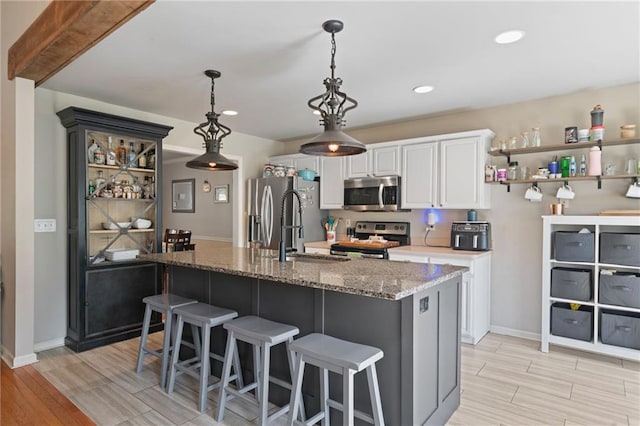 244 Bryn Brooke Dr, Dawsonville, GA 30534 - kitchen featuring appliances with stainless steel finishes, light wood-type flooring, white cabinets, baseboards, and recessed lighting