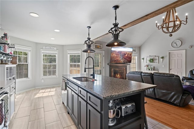 244 Bryn Brooke Dr, Dawsonville, GA 30534 - kitchen with a sink, open shelves, a lit fireplace, plenty of natural light, and recessed lighting