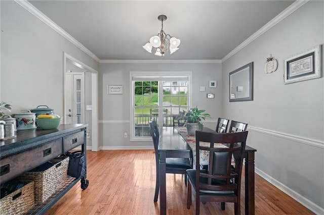 244 Bryn Brooke Dr, Dawsonville, GA 30534 - dining room with a chandelier, light wood-type flooring, crown molding, and baseboards
