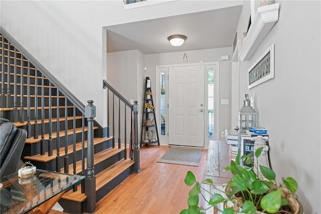 244 Bryn Brooke Dr, Dawsonville, GA 30534 - foyer entrance with wood finished floors and stairway