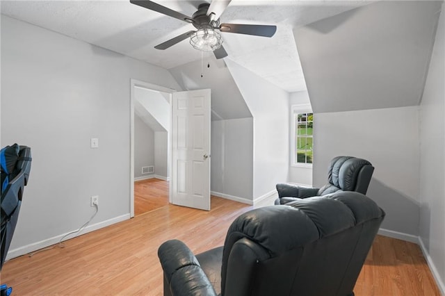 244 Bryn Brooke Dr, Dawsonville, GA 30534 - living room with vaulted ceiling, baseboards, light wood-style flooring, and a ceiling fan