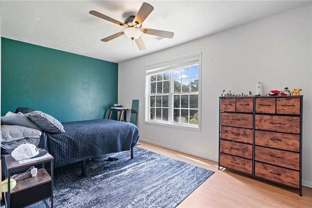 244 Bryn Brooke Dr, Dawsonville, GA 30534 - bedroom featuring wood finished floors, a ceiling fan, and baseboards
