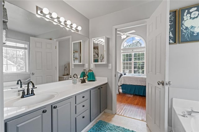 244 Bryn Brooke Dr, Dawsonville, GA 30534 - full bath with double vanity, a bath, ceiling fan, and ensuite bathroom