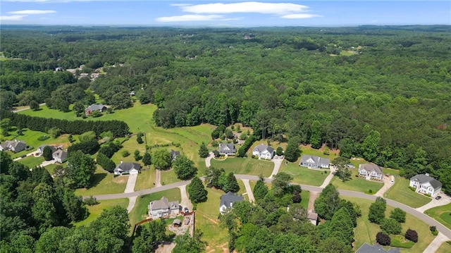 244 Bryn Brooke Dr, Dawsonville, GA 30534 - aerial view of property and surrounding area featuring a forest and nearby suburban area
