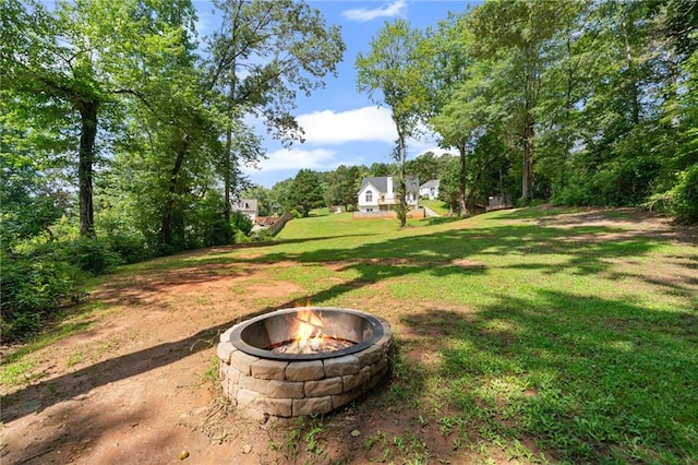 244 Bryn Brooke Dr, Dawsonville, GA 30534 - view of green lawn featuring an outdoor fire pit