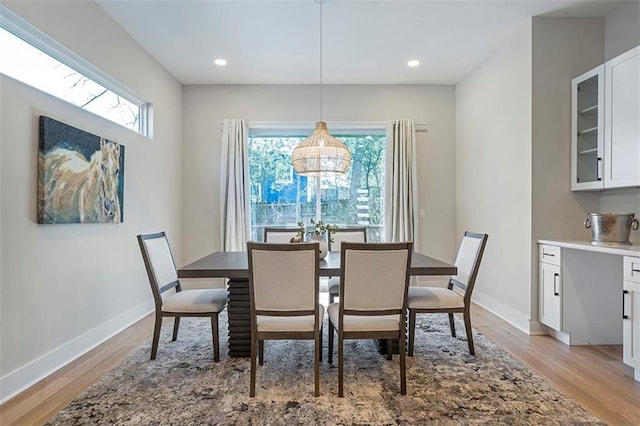 dining area with recessed lighting, baseboards, and light wood-type flooring