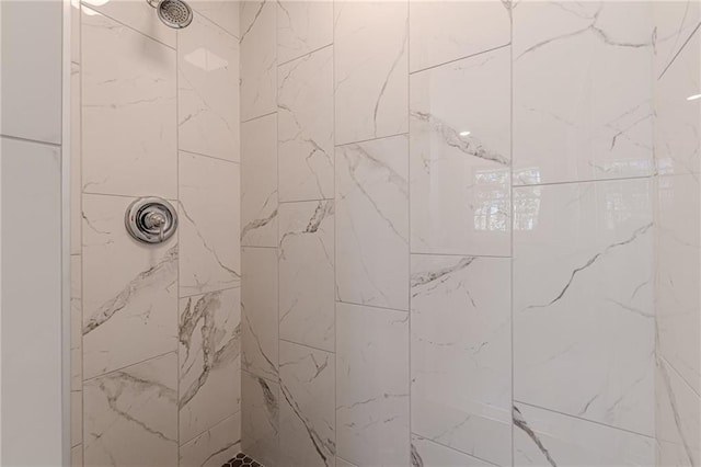 bathroom with a tile shower