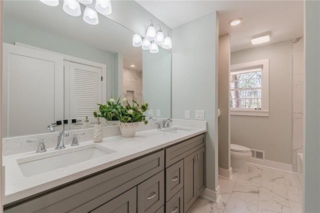 full bathroom with an inviting chandelier, visible vents, marble finish floor, and a sink