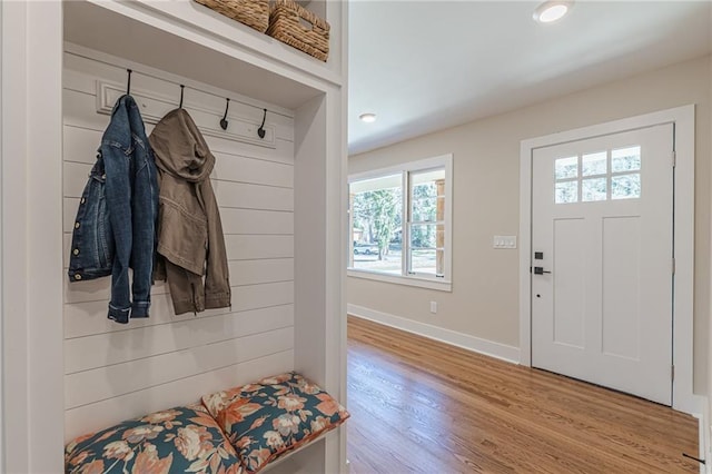 mudroom featuring recessed lighting, wood finished floors, and baseboards