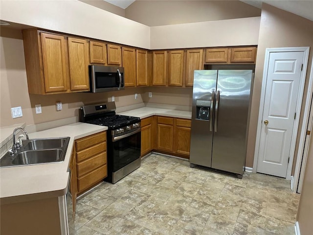 2191 Rockbridge Rd Unit 2603, Stone Mountain, GA 30087 - kitchen with appliances with stainless steel finishes, brown cabinets, light countertops, and stone finish flooring