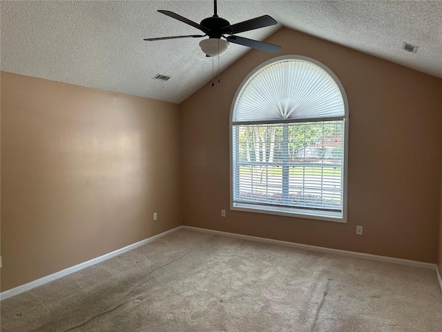 2191 Rockbridge Rd Unit 2603, Stone Mountain, GA 30087 - empty room featuring a textured ceiling, a ceiling fan, carpet flooring, and vaulted ceiling