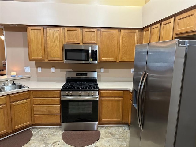 2191 Rockbridge Rd Unit 2603, Stone Mountain, GA 30087 - kitchen featuring appliances with stainless steel finishes, a sink, and brown cabinetry