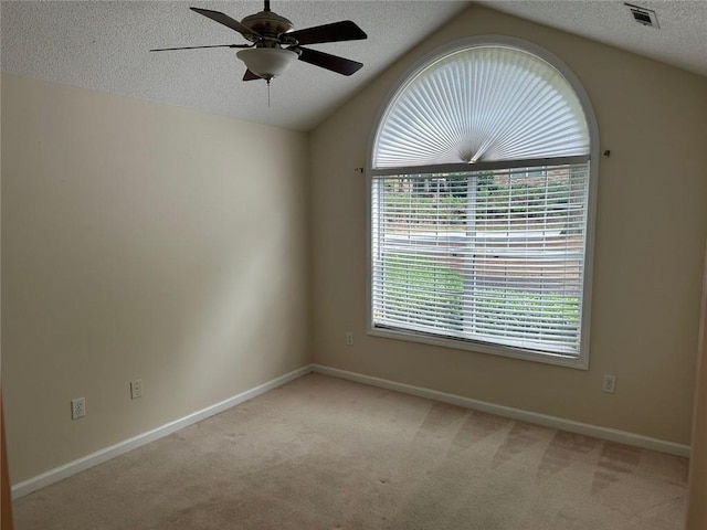2191 Rockbridge Rd Unit 2603, Stone Mountain, GA 30087 - spare room with light colored carpet, lofted ceiling, ceiling fan, and a textured ceiling