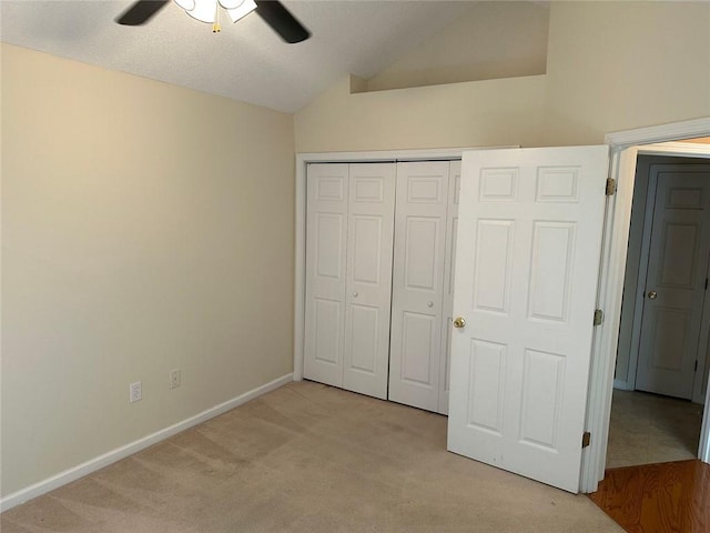 2191 Rockbridge Rd Unit 2603, Stone Mountain, GA 30087 - unfurnished bedroom featuring light colored carpet, lofted ceiling, a closet, and ceiling fan
