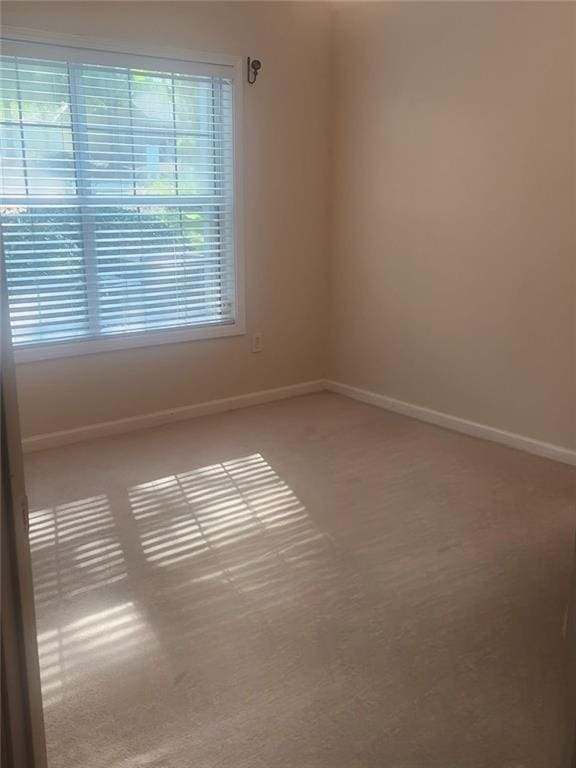 2191 Rockbridge Rd Unit 2603, Stone Mountain, GA 30087 - spare room with carpet flooring and baseboards