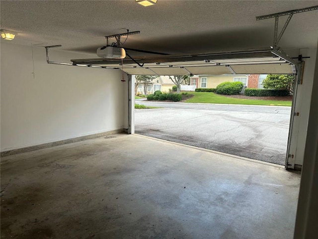 2191 Rockbridge Rd Unit 2603, Stone Mountain, GA 30087 - garage featuring a garage door opener and baseboards