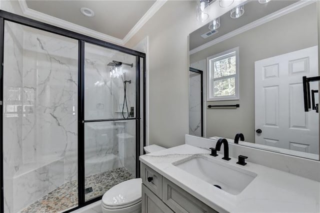 full bathroom with crown molding, toilet, a marble finish shower, and vanity