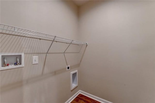 clothes washing area with washer hookup, laundry area, baseboards, electric dryer hookup, and wood finished floors