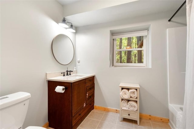 full bathroom featuring vanity, shower / tub combo with curtain, tile patterned floors, and toilet