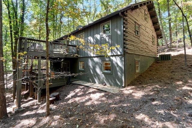 view of property exterior featuring a wooden deck