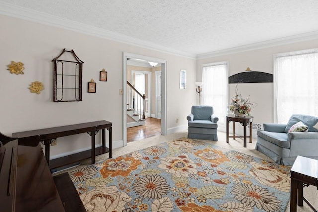 living room featuring crown molding, light colored carpet, and a textured ceiling