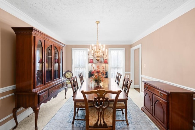 carpeted dining room featuring an inviting chandelier, crown molding, and a textured ceiling