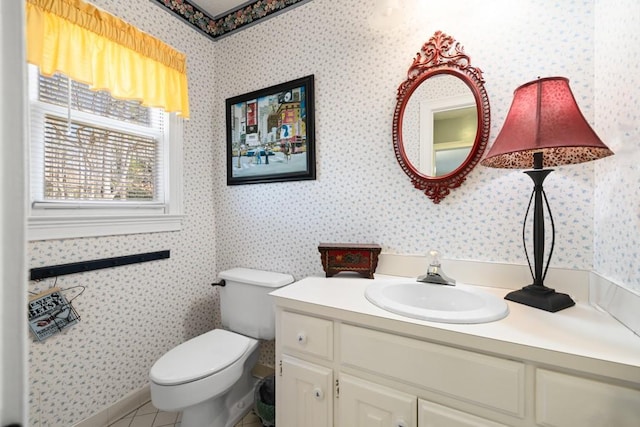 bathroom featuring vanity, toilet, and tile patterned flooring