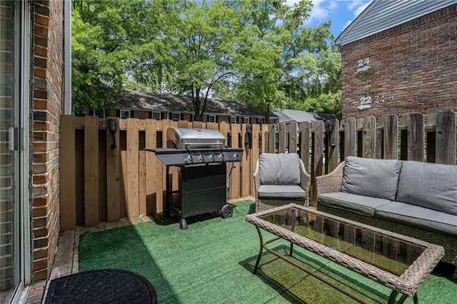 6700 Roswell Rd NE Unit 25A, Sandy Springs, GA 30328 - view of patio featuring an outdoor hangout area, fence, and a grill