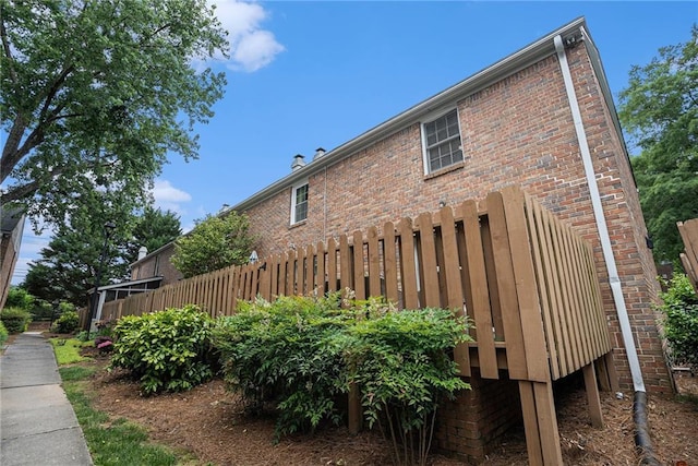 6700 Roswell Rd NE Unit 25A, Sandy Springs, GA 30328 - view of side of property featuring brick siding and fence