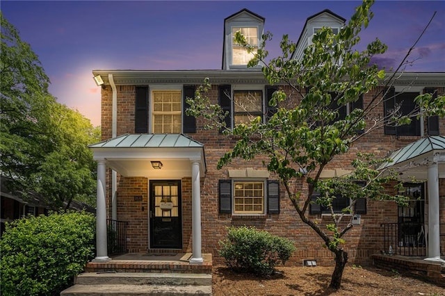 6700 Roswell Rd NE Unit 25A, Sandy Springs, GA 30328 - view of front facade featuring brick siding and a standing seam roof