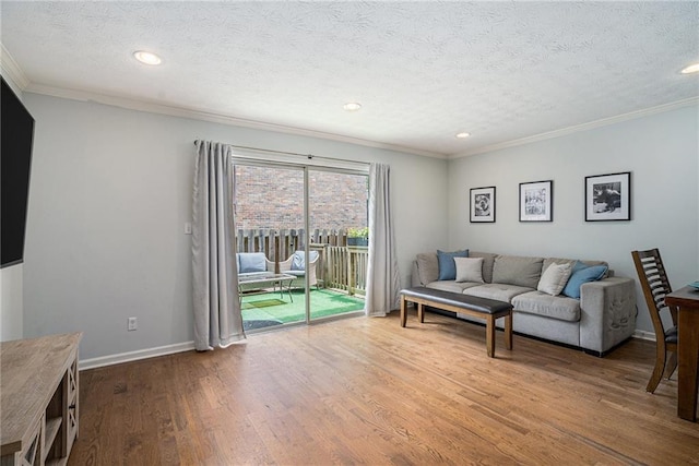 6700 Roswell Rd NE Unit 25A, Sandy Springs, GA 30328 - living room with ornamental molding, a textured ceiling, wood finished floors, recessed lighting, and baseboards
