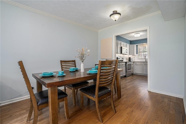 6700 Roswell Rd NE Unit 25A, Sandy Springs, GA 30328 - dining room with wood finished floors, crown molding, and baseboards
